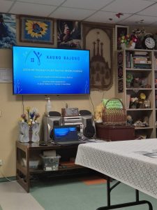 Ekrane rodomas Kauno rajono socialinių paslaugų centro pranešimo „Socialinė pagalba Kauno rajono bendruomenėje“ titulinis lapas, kuriame nurodytos pranešėjos Audronė Baškienė ir Virginija Černevičienė.